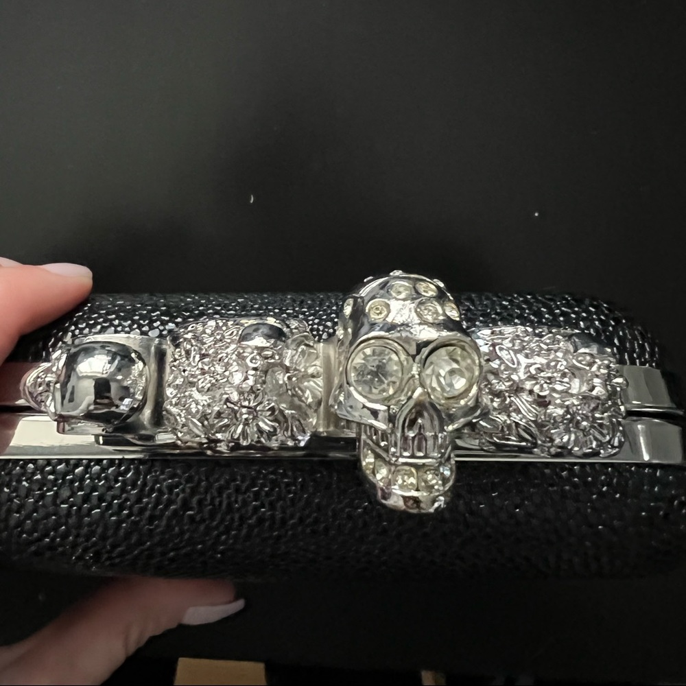 Black and silver brass knuckle clutch